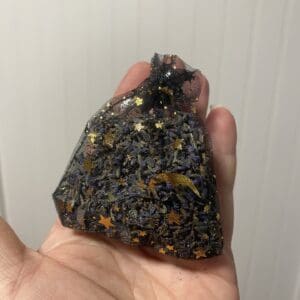 Hand holding a homemade Lavender aromatherapy Mesh Bag in Black - a chic and aromatic accessory for relaxation and tranquility.